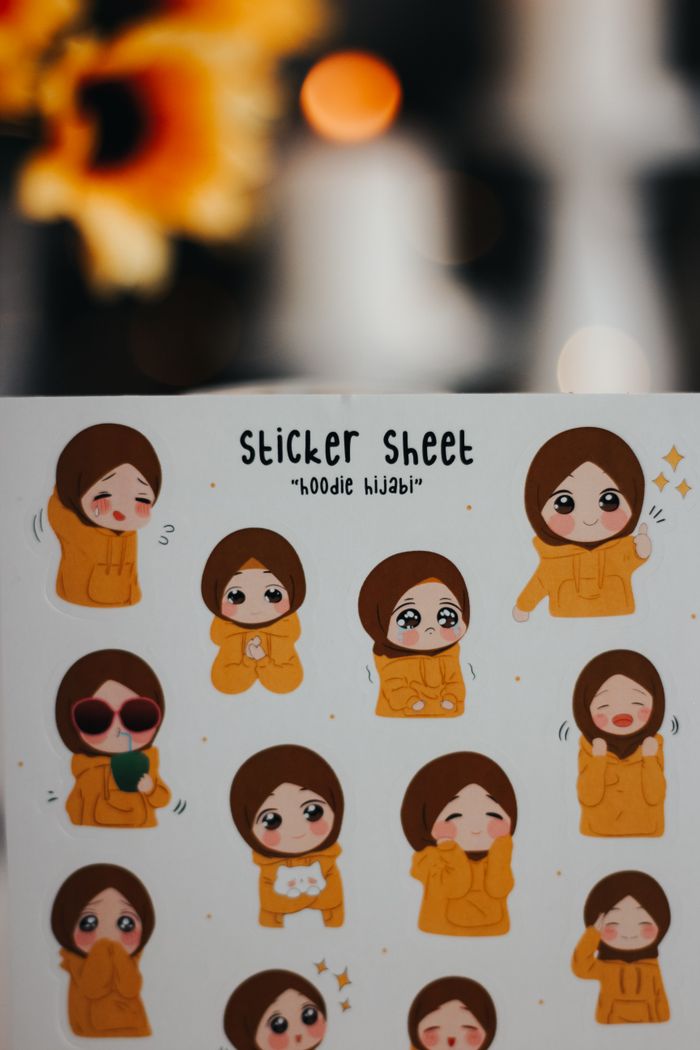 Charming sticker sheet featuring cartoon characters in hoodies with various expressions.